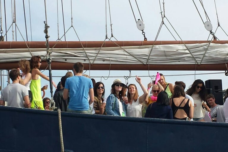 Classic sailboat with people dancing