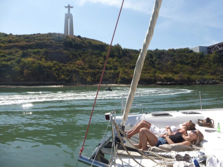 Girls relaxing on the catamaran nets
