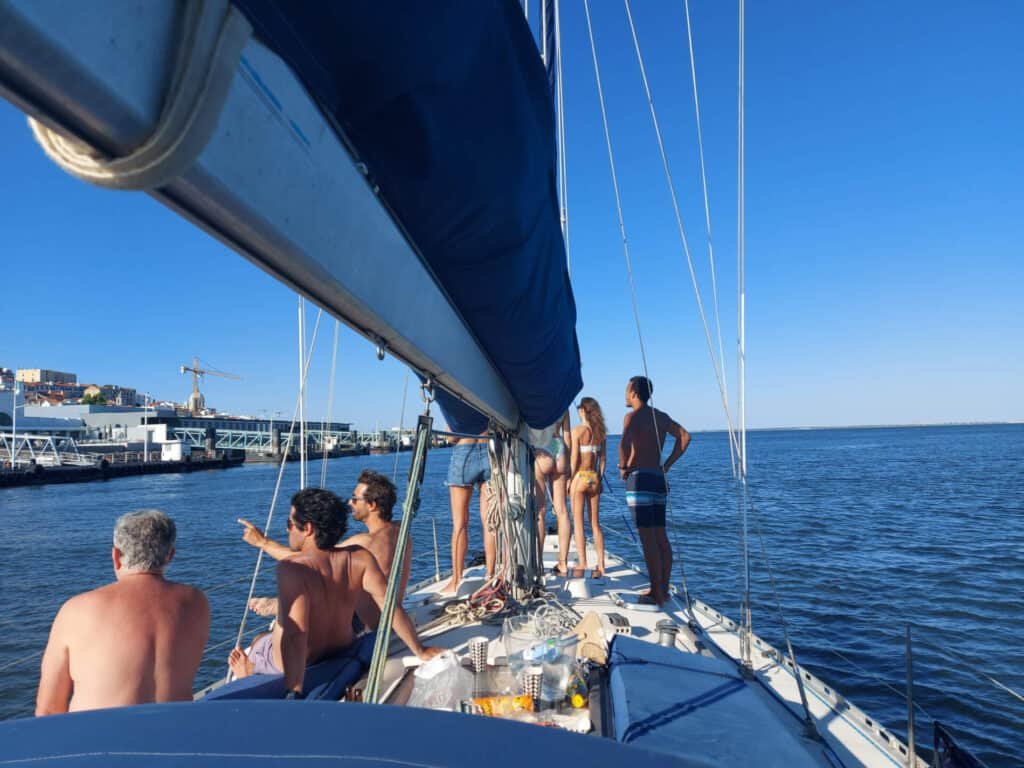 Group of friends on a sailboat in Lisbon