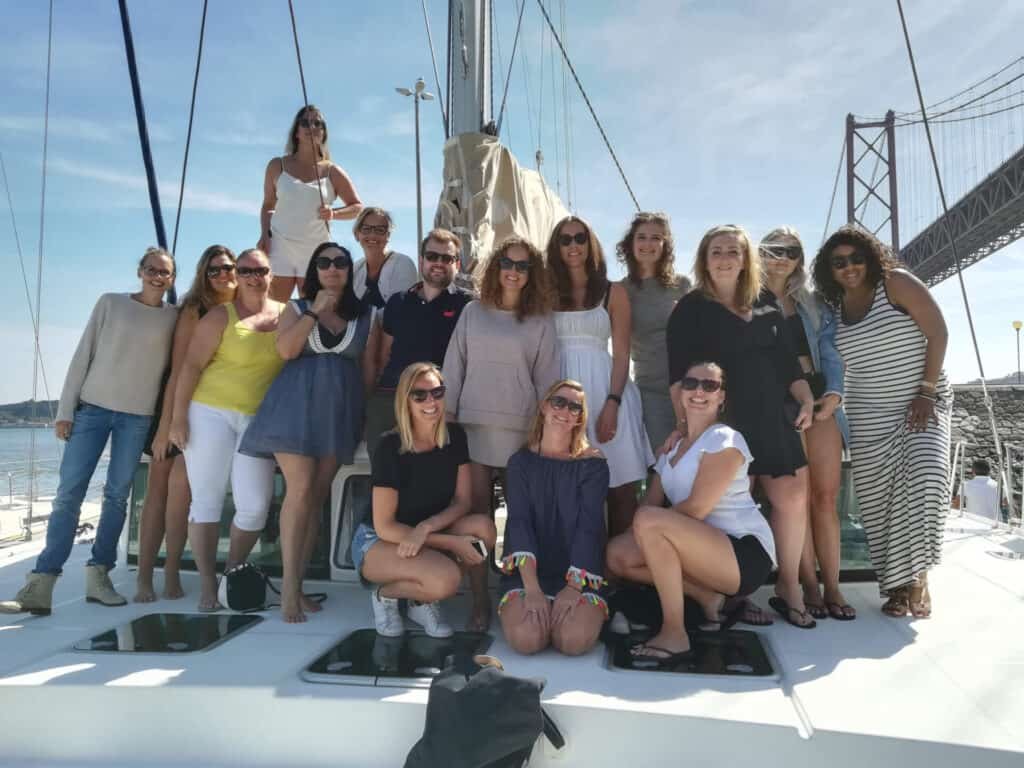 People on the bow of the catamaran during a corporate event