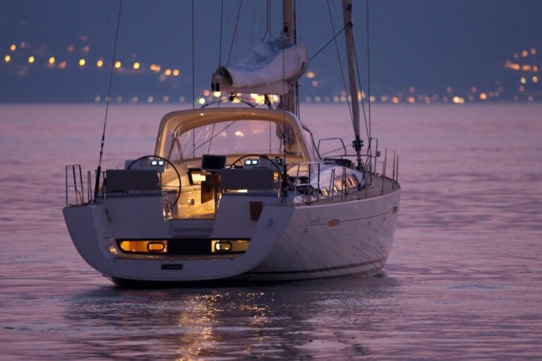 Luxury sailboat at dusk in the city of Lisbon (rear view)