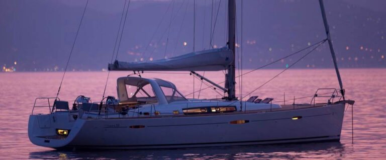 Luxury sailboat at dusk, in the city of Lisbon (side view)