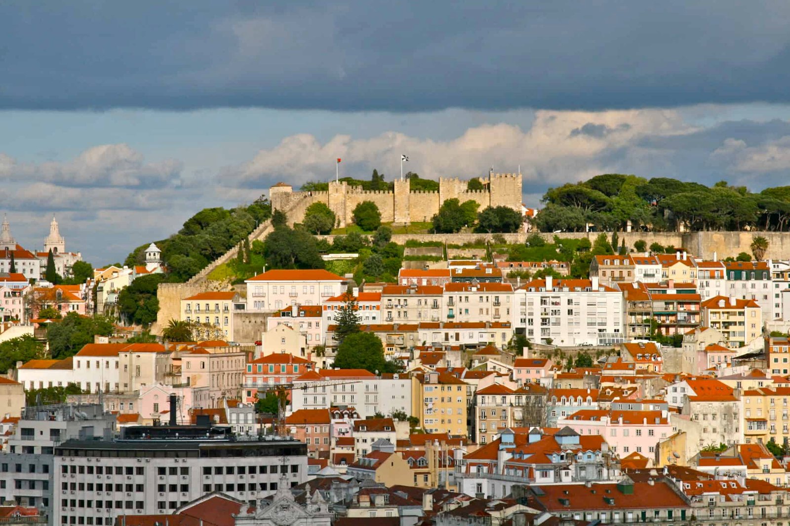 Sailboat sailing with Saint Jorge Castle in the background