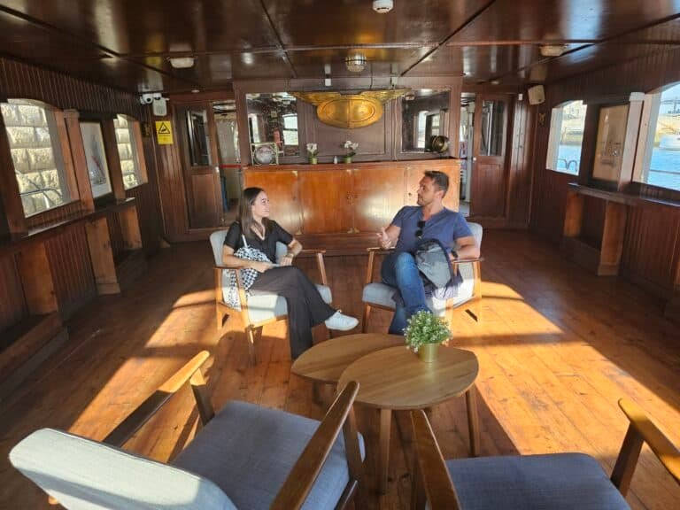People enjoying the stern lounge sitting on chairs