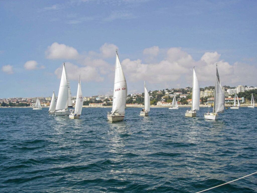Regatta on the Tagus River, with around 12 sailboats