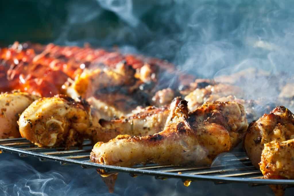 Sausage and chicken on the barbecue - barbecue on board