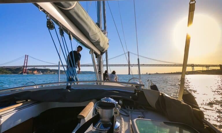 A couple sailing on the Tagus River during a wonderful day in Lisbon