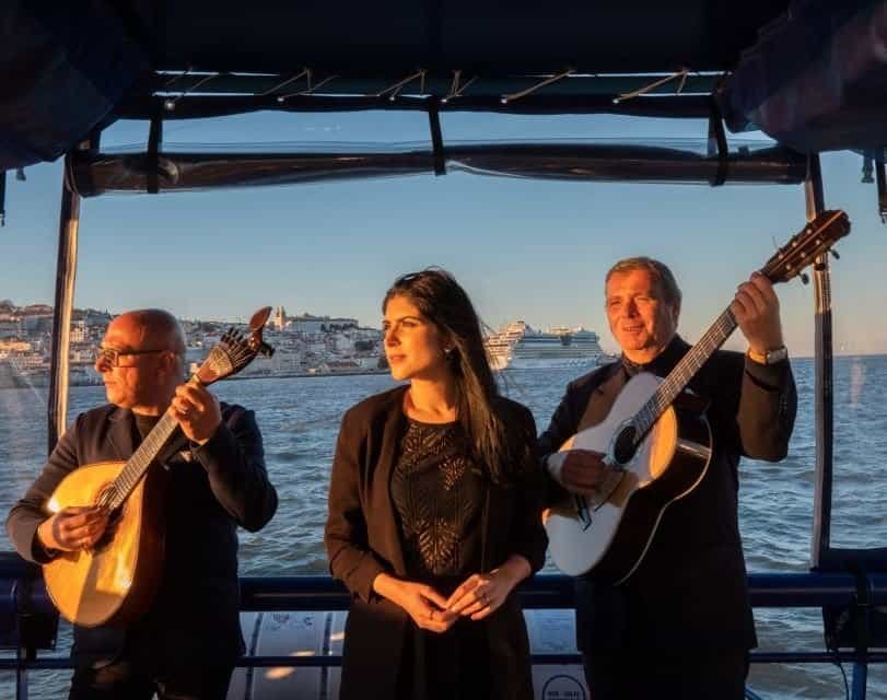 Fado singer accompanied by two guitarists, during a boat trip on the Tagus River