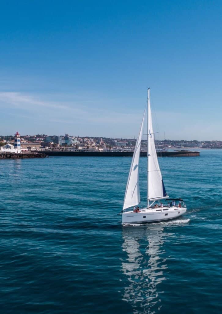 Elegant sailboat navigating the waters of the Tagus River