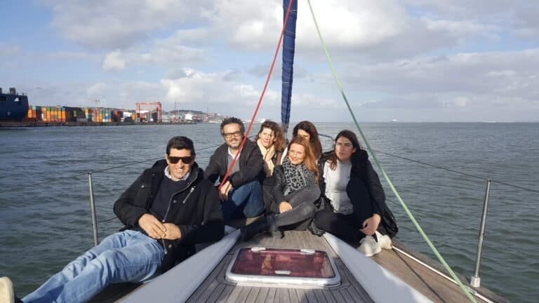 Late afternoon boat tour on the Tagus River with friends on the boat's bow