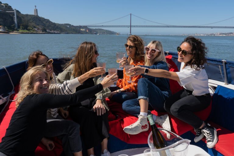 A toast among friends on the Tagus River on a beautiful sunny day