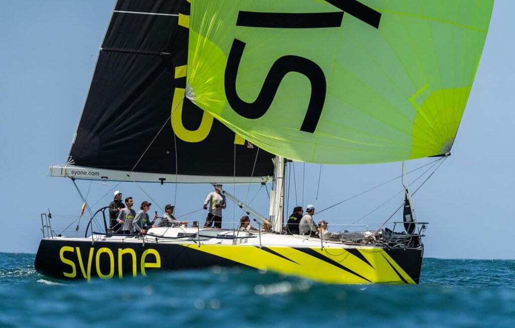 The boat and crew during training, showing the unique design of the sail