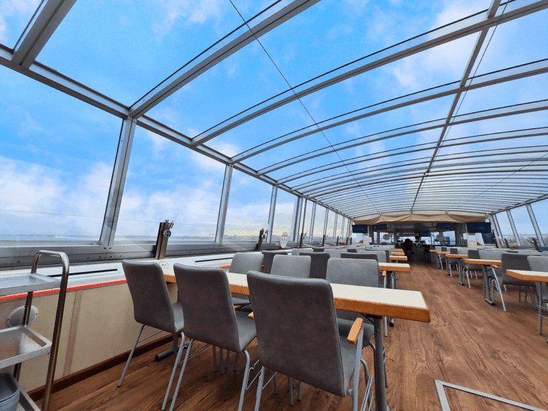 Dining area under the panoramic roof, providing a bright and comfortable environment for groups looking for a stunning setting