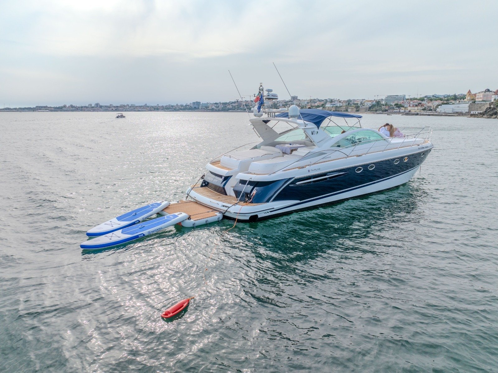 Luxury charter aboard the Katerina Targa in Cascais, a Fairline Targa 52 that combines comfort, outdoor space, and water activities in a private experience for up to 10 passengers.